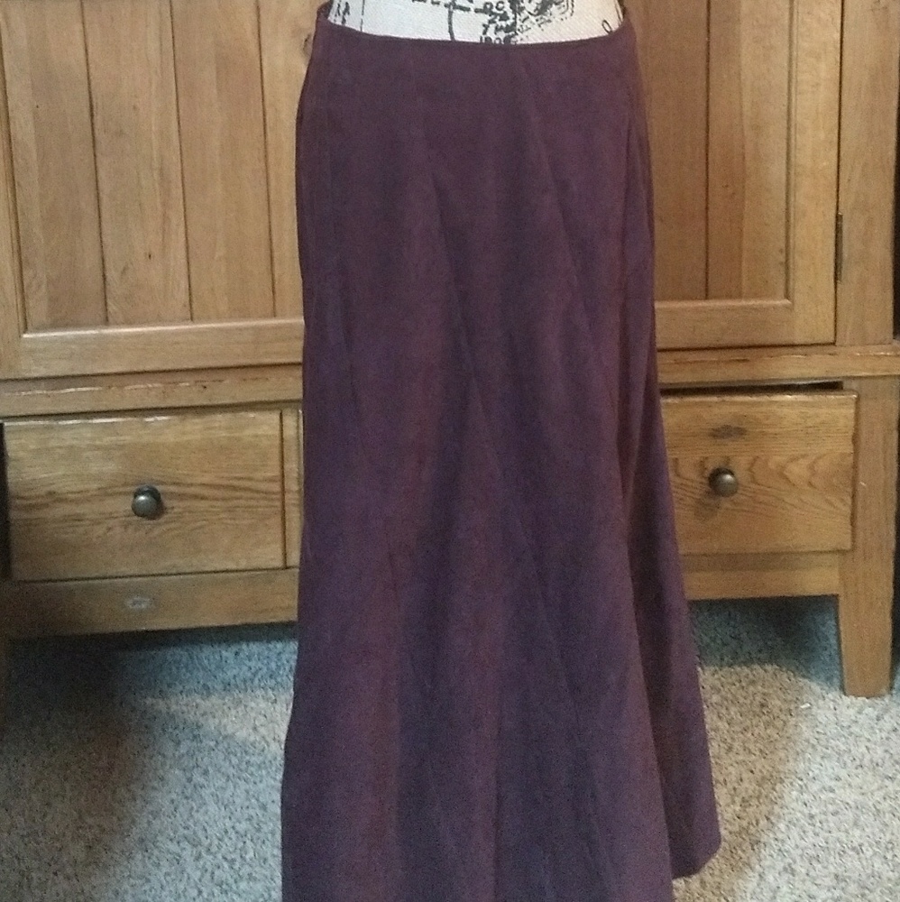 Ankle length maroon skirt.